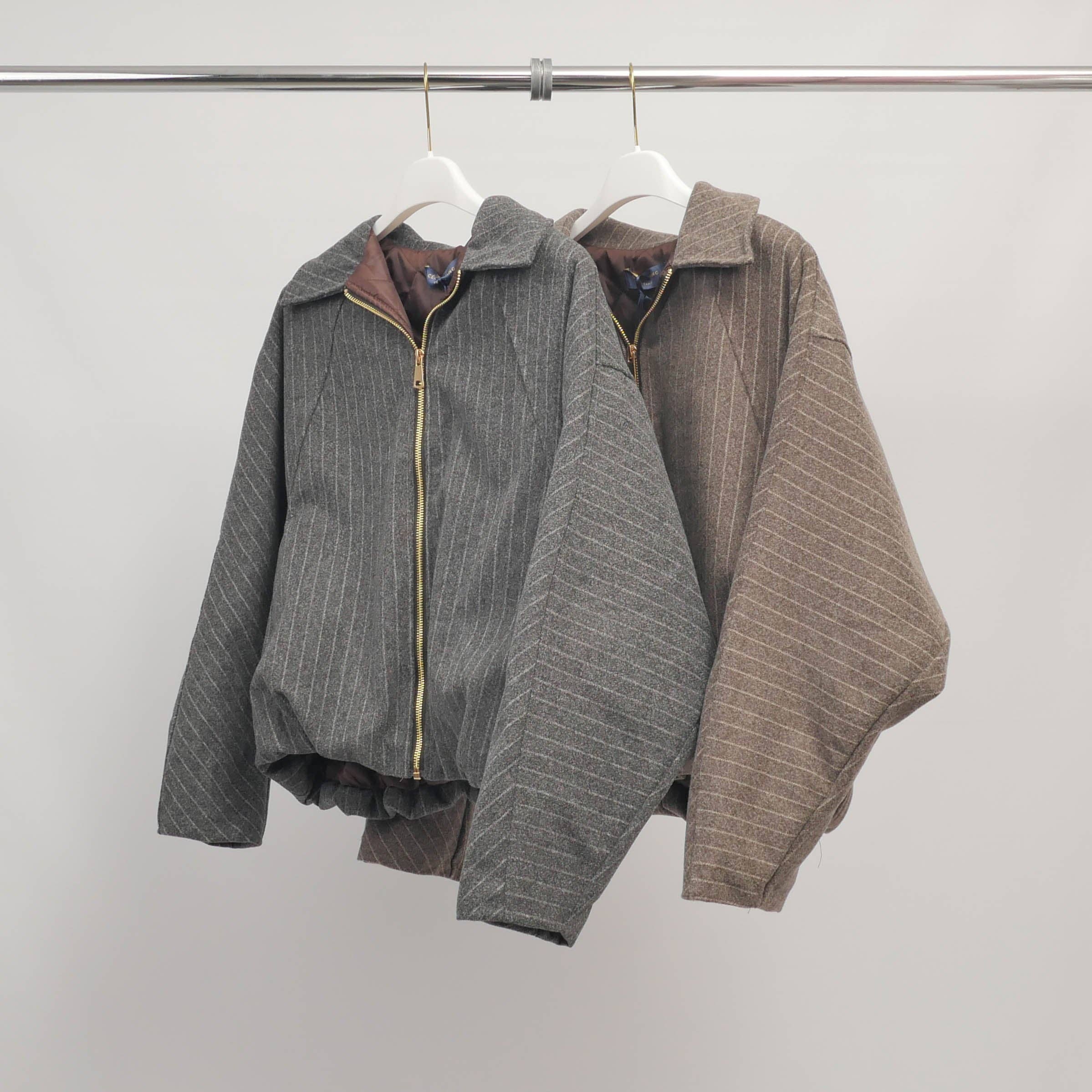 Elasticated fine striped zip-up jacket at the base